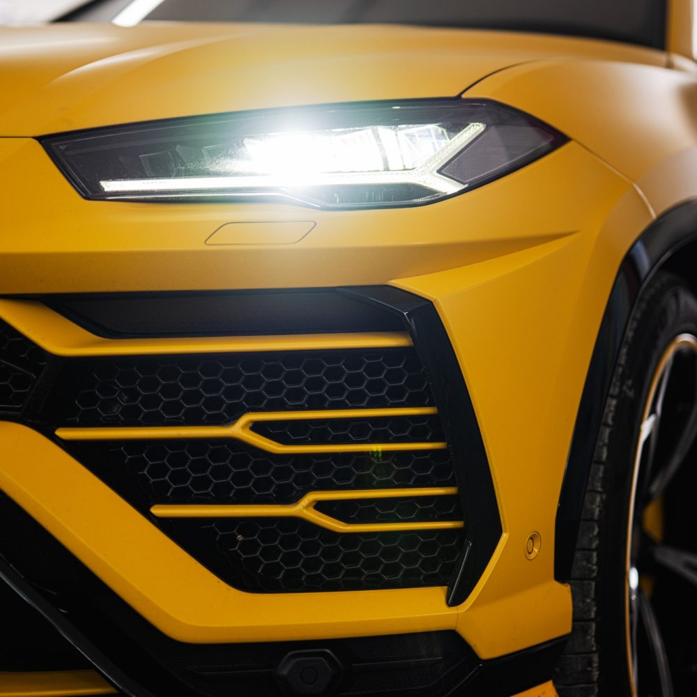 Headlights of yellow sport car suv.